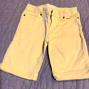 Girls yellow Bermuda shorts.  Size 7